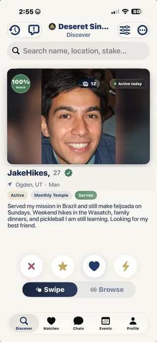 The Discover screen showing a member's card, badges and a 100% match